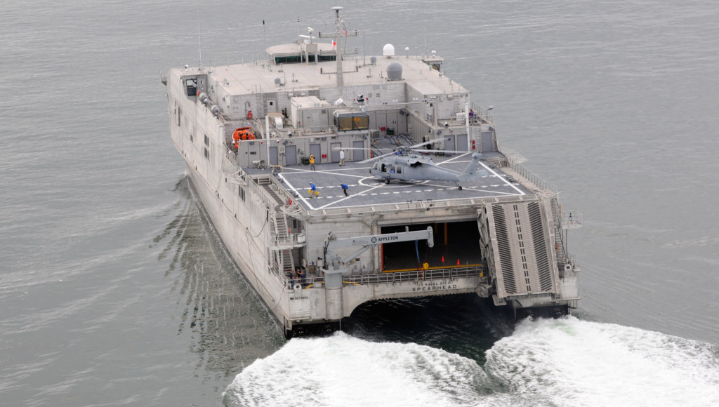 ATLANTIC OCEAN (Aug. 20, 2013) The Military Sealift Command joint high-speed vessel USNS Spearhead (JHSV 1) conducted high-speed trials, reaching speeds of approximately 40 knots off the coast of Virginia. Adm. Bill Gortney, commander of U.S. Fleet Forces, was aboard for the trial and was on the first helicopter to make a regularly scheduled passenger landing on the ship since passing its initial certification. (U.S. Navy photo by Mass Communication Specialist 1st Class Phil Beaufort/Released)