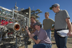 Engineers prepare a 3-D printed breadboard engine made up of 75 percent of the parts needed to build a rocket engine for a test at Marshall in Alabama. (Image: NASA/MSFC/Emmett Given)