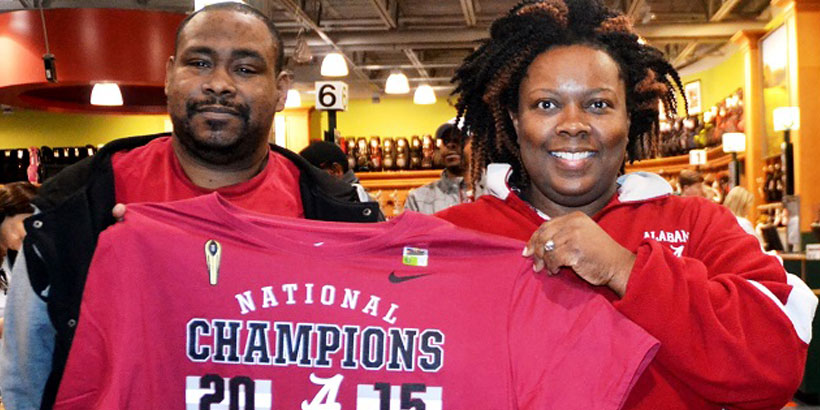 Geoffrey Lyles, left, and Donta Lyles were among the late-nigh shoppers seeking Crimson Tide championship gear. (Solomon Crenshaw Jr./Alabama NewsCenter)