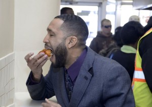 A customer and downtown Birmingham employee enjoys a restaurant favorite. (Ted Tucker/Alabama NewsCenter)