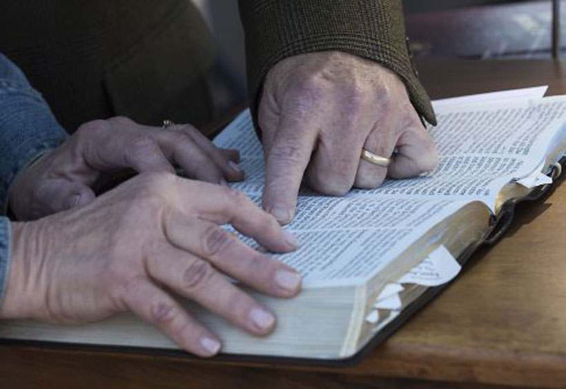 The Clelands enjoy reading the Bible together. (Photo by Bernard Troncale.)