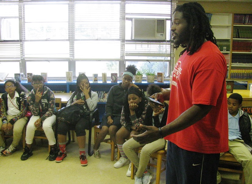 Jeremy Towns leads a Bible study called First Priority before the school day begins at Putnam Middle School. The former NFL player and soon-to-be medical student is trying to help the school’s students get onto a positive path in life and stay off the school-to-prison track that snags many at-risk youth. (Nathan Turner Jr./Alabama NewsCenter)