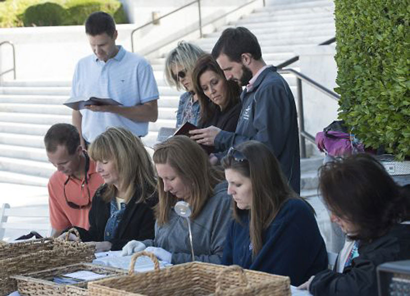 Readers waited patiently for their turn to read the Scriptures. (Photo by Bernard Troncale).