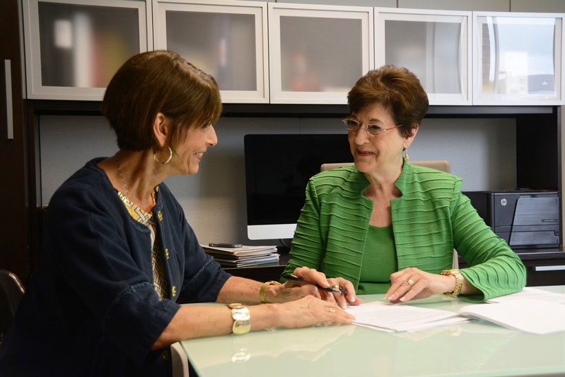 June Henton, right, talks with a key partner in her efforts against world hunger, Hunger Solutions Institute Director Harriet Giles. (Karim Shamsi-Basha/Alabama NewsCenter)