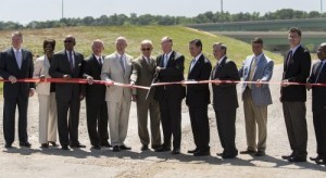 Gov. Robert Bentley is joined by elected officials and business leaders to cut the ribbon on Interstate 22. (Christopher Jones/Alabama NewsCenter)