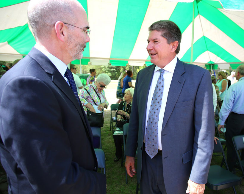 Alabama Power’s Zeke Smith, right, and Michael McGhee, executive director of the Army Office of Energy Initiatives, chat after a ground breaking on the company’s second, large-scale solar energy project Thursday, June 2, 2016, at Fort Rucker. (Mike Kittrell/Alabama NewsCenter)