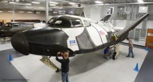 Technicians inspect the Dream Chaser spaceplane. (Image: Sierra Nevada Corp.)