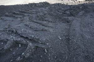 Bulldozer tracks cross a coal pile. A steep decline in the number of coal-industry jobs has affected 19 Alabama counties. Southern Research has been awarded a grant to develop a plan to spur the region’s economies using the abilities of the available workforce. (File)