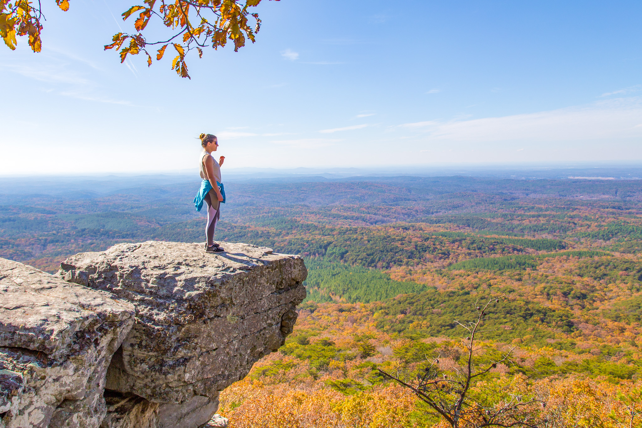 girl on rock overlooking mountain